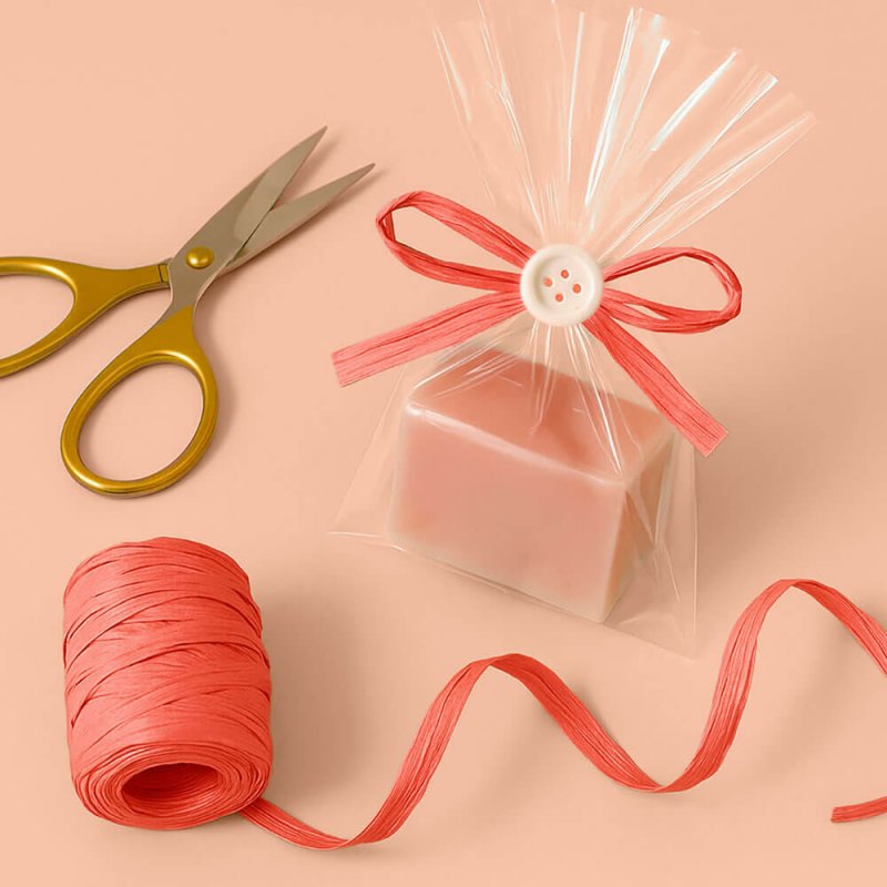 Cinta de rafia coral para decorar bolsas de regalo