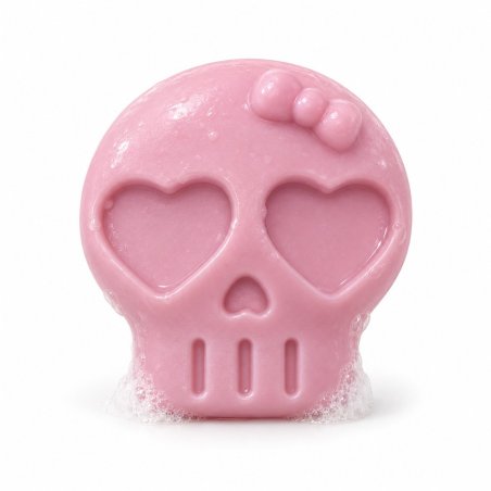 Jabón rosa de calavera con lazo y ojos de corazón con espuma sobre fondo blanco