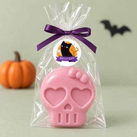 Jabón rosa de calavera con lazo y ojos de corazón en bolsa transparente con lazo morado