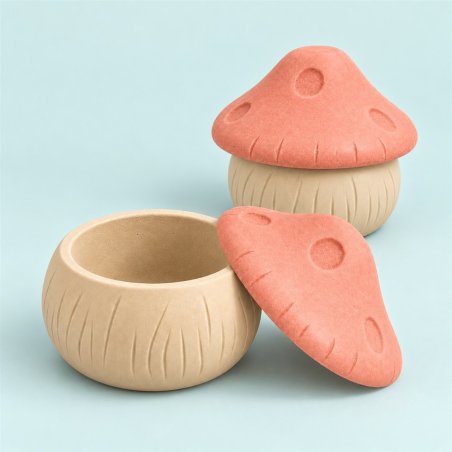 Deux récipients à couvercle champignon beige et corail, l’un ouvert et l’autre fermé