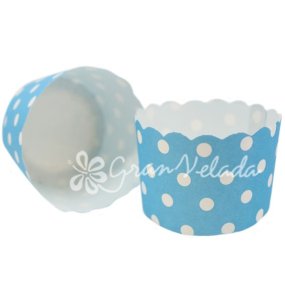 Capsules de cupcake bleu avec des taupes blanches Capsules de cupcake bleu avec des taupes blanches